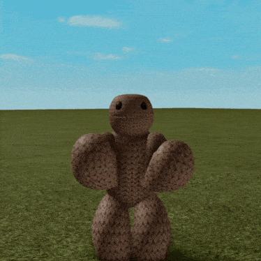 a stuffed animal with a knitted pattern is standing in a field