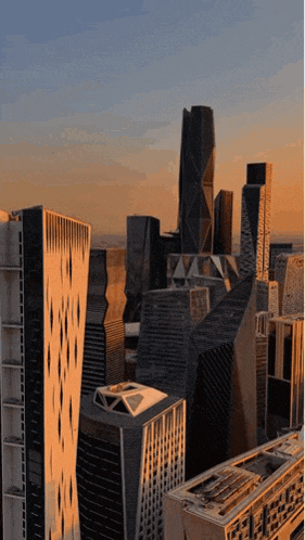 an aerial view of a city at sunset