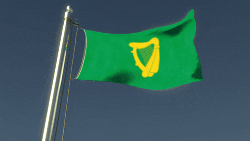 a green flag with a yellow harp on it is flying in the wind