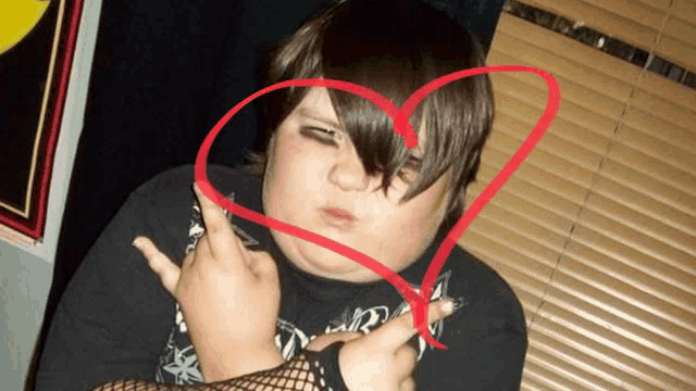 a person with a red heart around their head and a black shirt