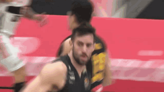 a blurry picture of a basketball player dribbling the ball