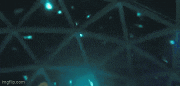 a person is swimming in a pool with a blue object in the middle of the water .