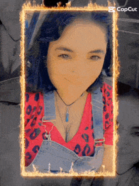 a woman in overalls is surrounded by flames and the word capcut is on the bottom right