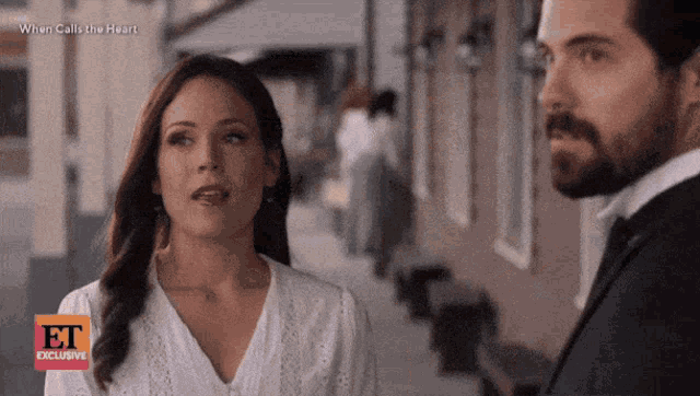 a man and a woman are looking at each other in a scene from when calls the heart exclusive