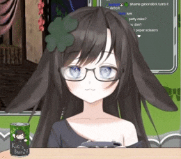 a girl with glasses and a clover on her head is sitting at a table with a can of kiki 's beer