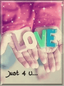 a person holding the word love in their hand