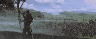 a man with a bow and arrow stands in front of a large army of soldiers