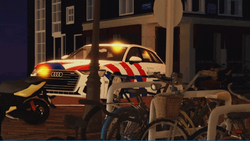 a red white and blue police car with the word audi on the front
