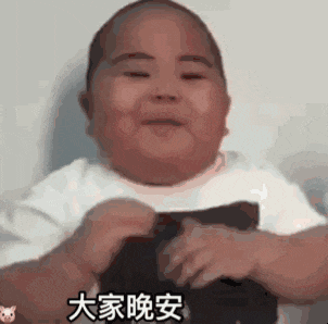 a baby is sitting in a chair and smiling with chinese writing on it .