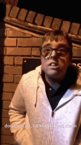 a man wearing glasses and a white jacket says do n't u start