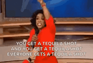 a woman in a red dress is holding a microphone and says you get a tequila shot