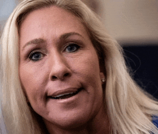 a close up of a woman 's face with her mouth open
