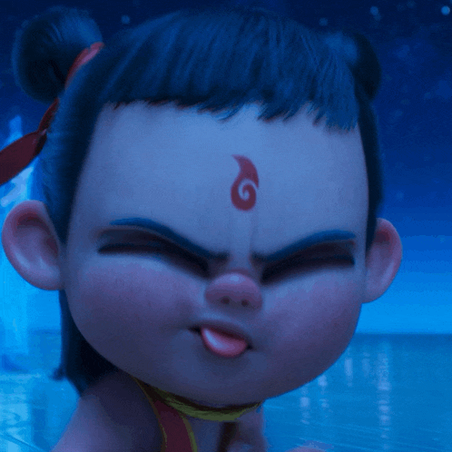 a close up of a child 's face with a red s on his forehead