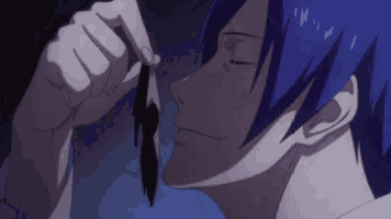 a close up of a person 's face with a purple hair