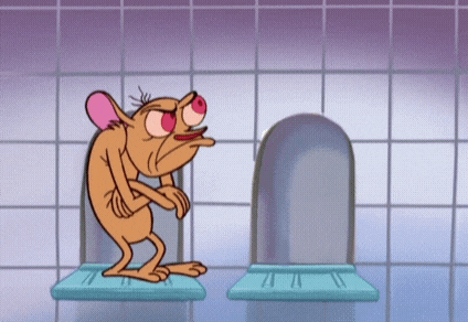 a cartoon character is standing in front of a urinal .
