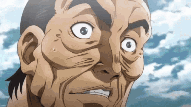 a close up of a man 's face with big eyes