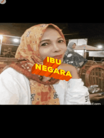 a woman with a scarf around her head has the word ibu negara written on her face