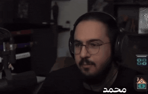 a man wearing headphones and glasses has a house with a dollar sign in the corner