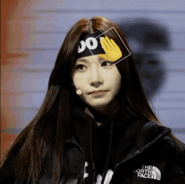 a woman wearing a headband that says " do " on it