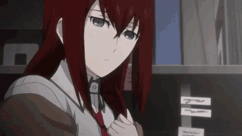 a girl with red hair and blue eyes is standing in front of a shelf with sticky notes on it