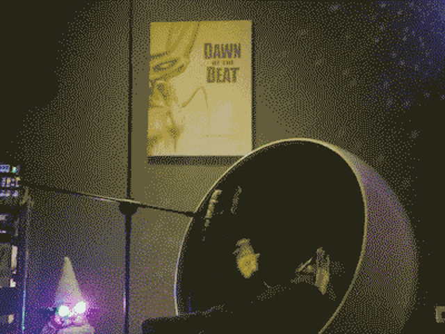 a poster for dawn of the beat hangs on a wall above a chair