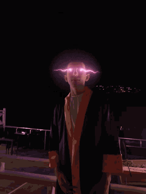 a man in a graduation cap and gown has lightning bolts coming out of his eyes