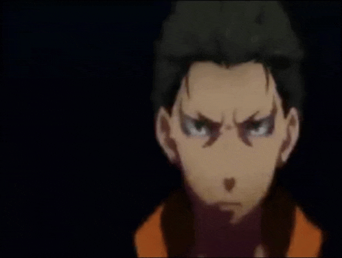a close up of a person 's face with a serious look on his face .