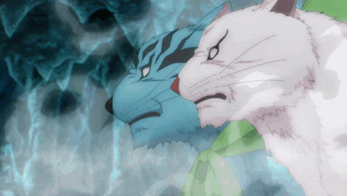 a blue and white cat are looking at each other with their eyes closed