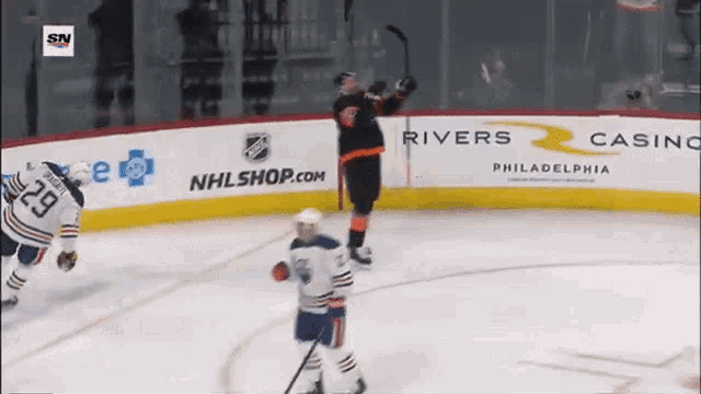 a hockey game is being played in philadelphia sponsored by nhlshop.com and rivers casino