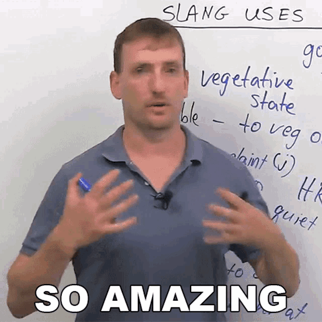 a man stands in front of a white board with the words " so amazing " written on it
