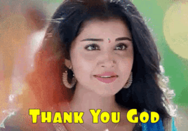 a close up of a woman 's face with the words `` thank you god '' written above her .