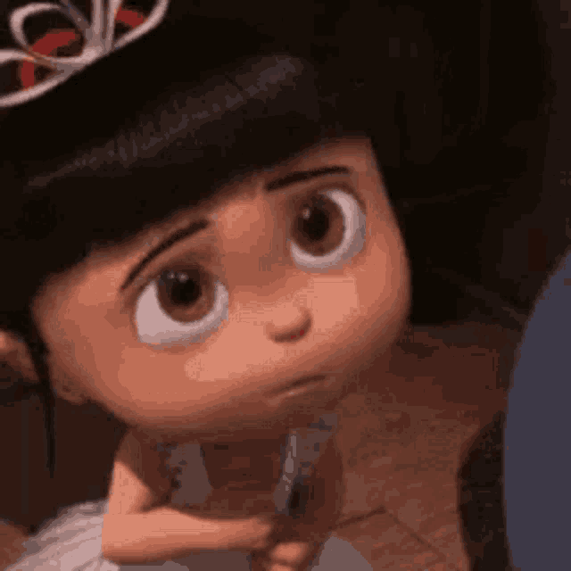 a little girl from despicable me is wearing a tiara .