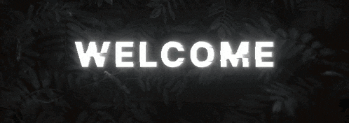 a sign that says " welcome " in yellow letters