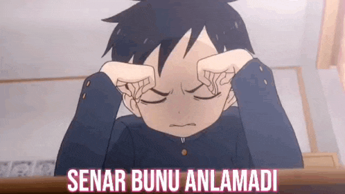 a cartoon boy is sitting at a desk with his hands on his face and covering his eyes .