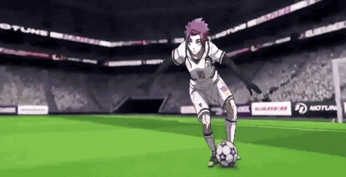 a soccer player is kicking a soccer ball on a field with a motul ad in the background