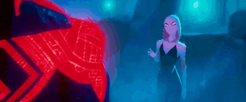 a woman in a black dress is standing in front of a red spider-man .