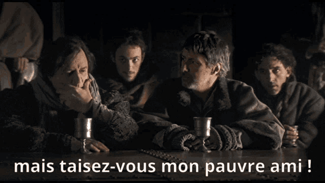 a group of men sitting at a table with the words mais taisez-vous mon pauvre ami written below them