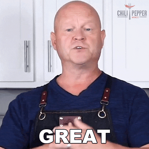 a bald man wearing an apron says great