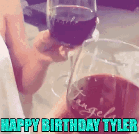 a person is holding a glass of wine with the words happy birthday tyler written on it