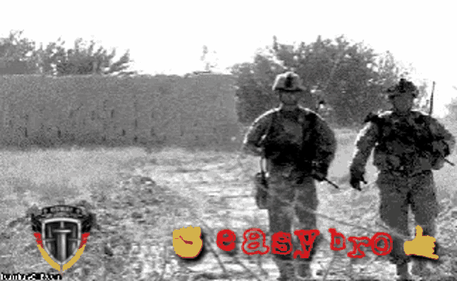 a black and white photo of two soldiers with easy bro written on the bottom right