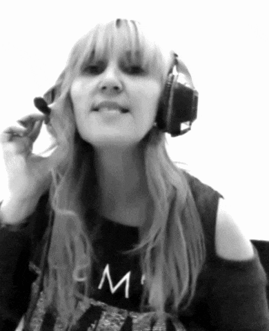 a woman wearing headphones and a shirt that says ' m ' on it