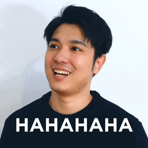a man is laughing in front of a sign that says hahaha