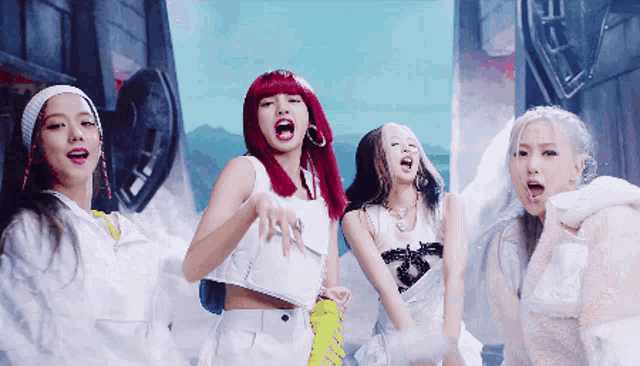 a group of girls with red hair are standing together