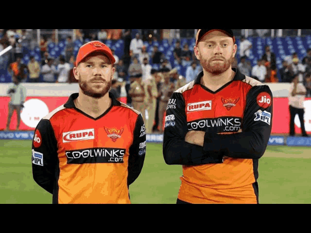 two men wearing rupa coolwinks and jio jerseys stand on a field