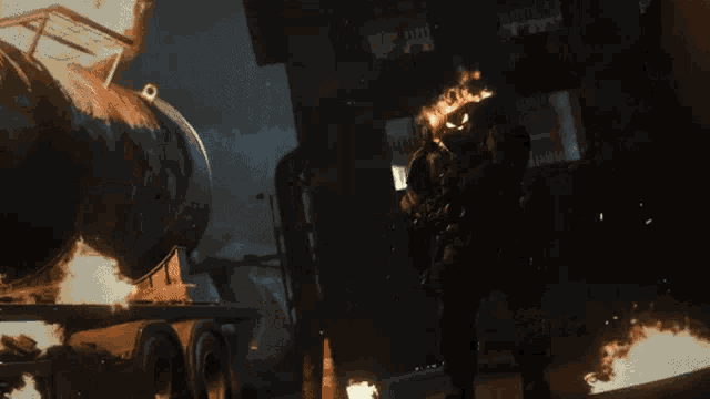 a man is holding a machine gun that is shooting fire
