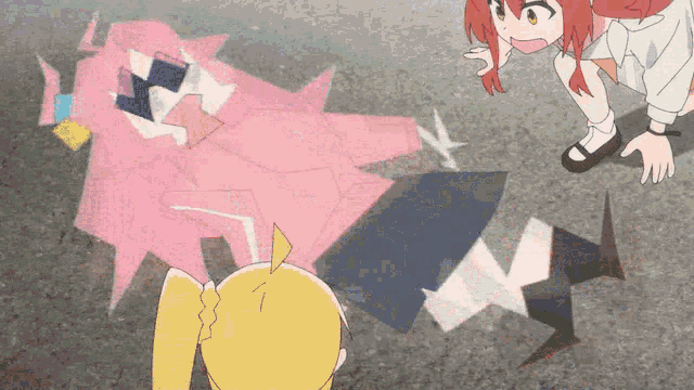 a girl with red hair is standing next to a girl laying on the ground