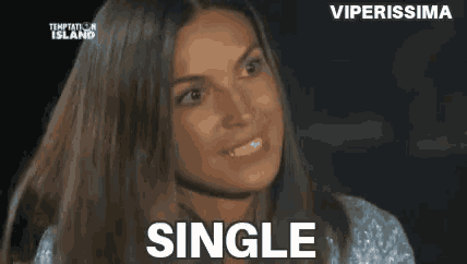 a woman is smiling and looking at the camera with the word single written on the bottom .