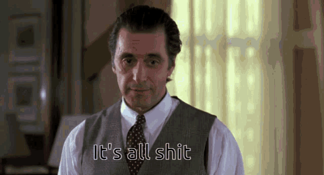 a man in a suit and tie says " it 's all shit "