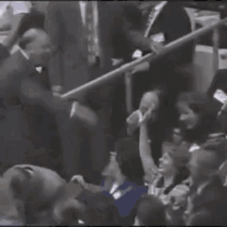a crowd of people are gathered in a stadium .