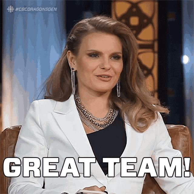 a woman sitting in a chair with the words great team written on her face